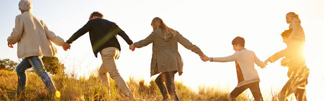 Family hiking holding hands